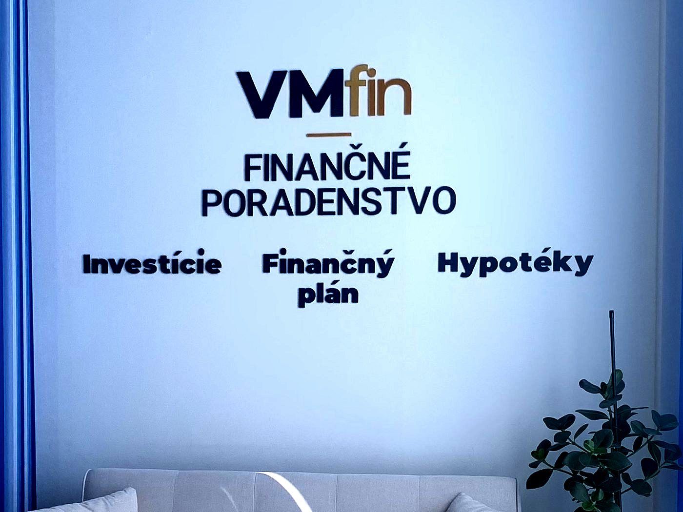 Three-dimensional logo and lettering on an office wall, made by 3D printing