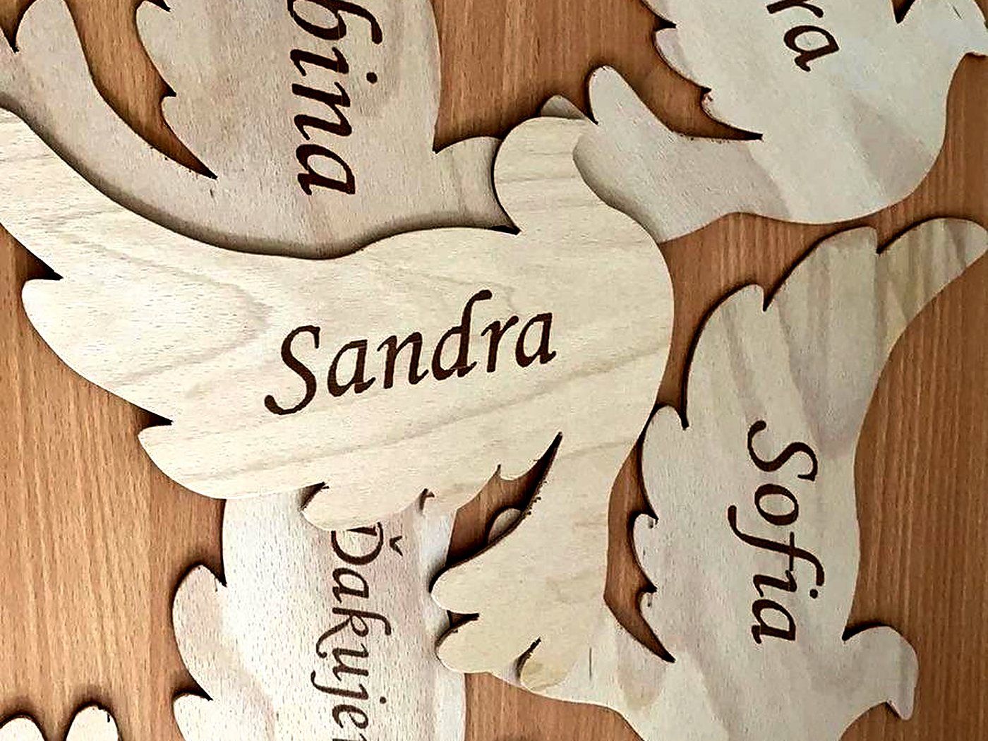 Wedding doves cut by laser and marked with guests' names